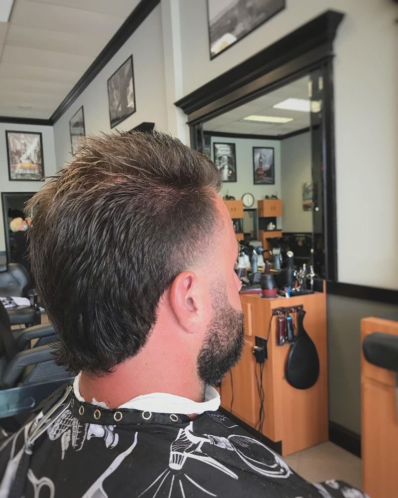 Textured cut with a full beard, seen from the side.